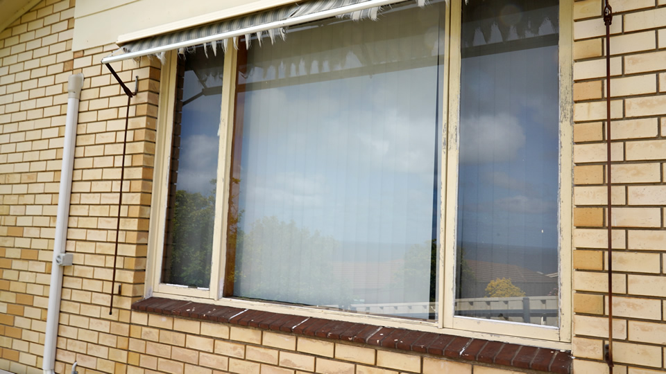 Replace large wooden windows with aluminium windows before