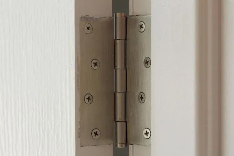 Wooden door with squeaky hinge